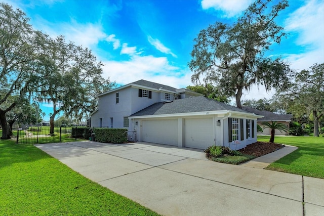 view of side of property with a garage and a lawn