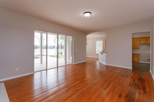 spare room with hardwood / wood-style flooring