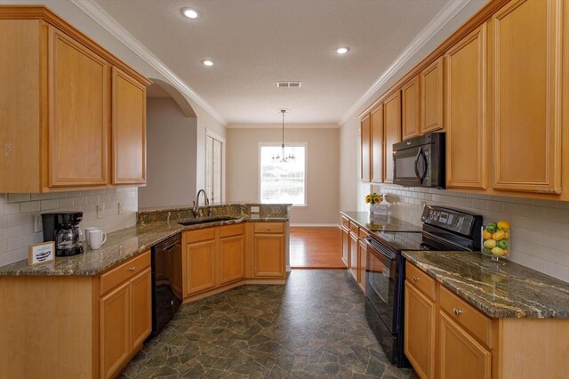 kitchen with black appliances, ornamental molding, pendant lighting, sink, and kitchen peninsula