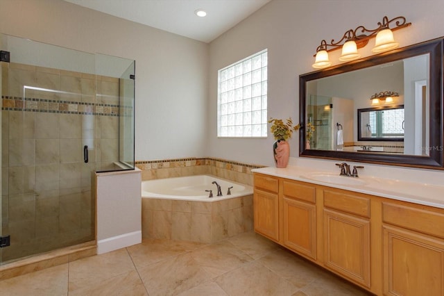 bathroom featuring tile patterned flooring, vanity, and separate shower and tub