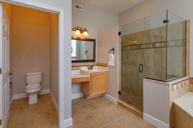 full bathroom featuring toilet, vanity, tile patterned flooring, and separate shower and tub