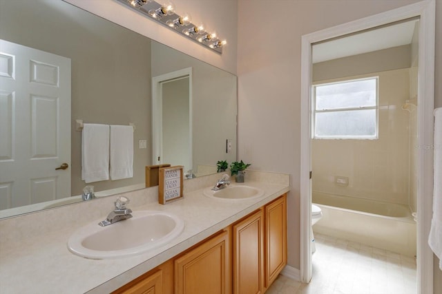 full bathroom with toilet, vanity, tiled shower / bath, and tile patterned flooring