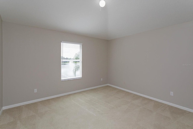 unfurnished room with light colored carpet