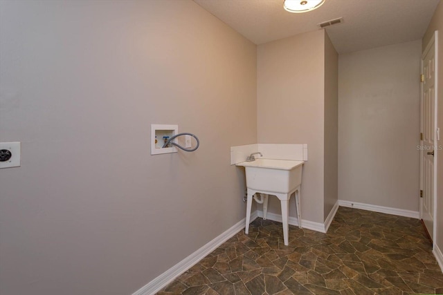 laundry area with hookup for a washing machine and hookup for an electric dryer