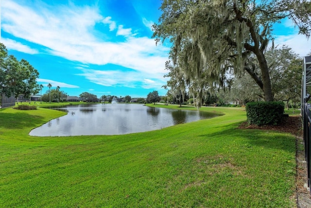 exterior space with a water view and a yard