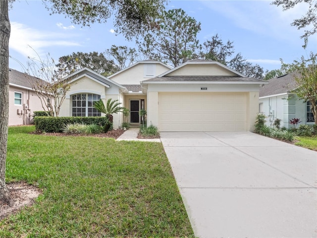 single story home featuring a garage and a front yard