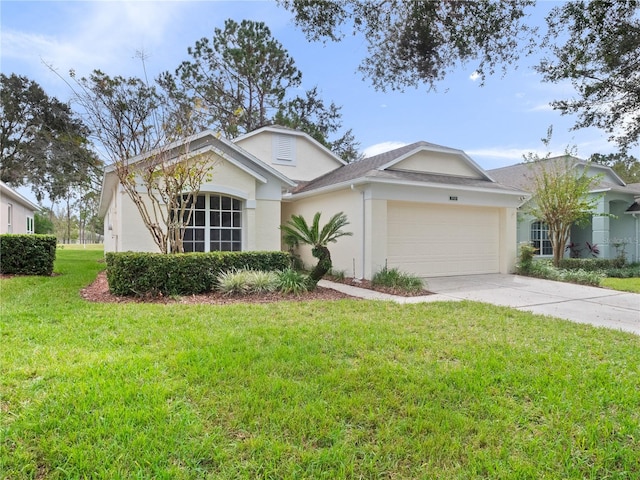 view of front of home with a front lawn and a garage