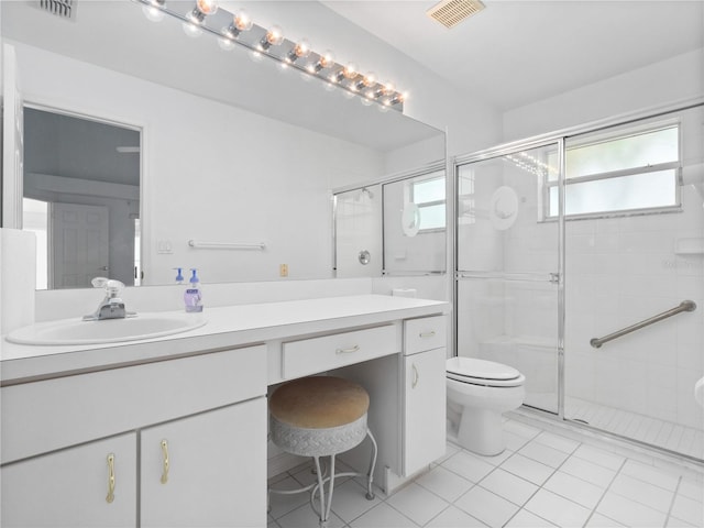 bathroom featuring vanity, a healthy amount of sunlight, and toilet