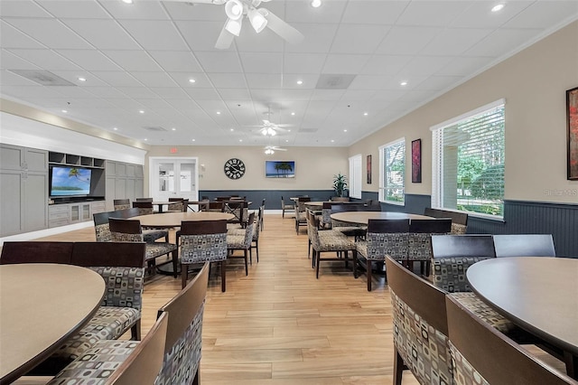 dining space featuring ceiling fan and light wood-type flooring