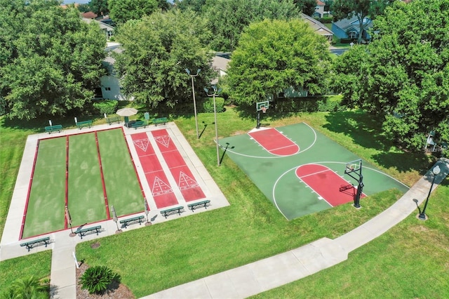 view of basketball court featuring a yard