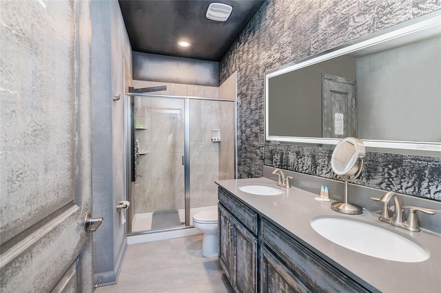 bathroom featuring walk in shower, tile patterned floors, vanity, and toilet