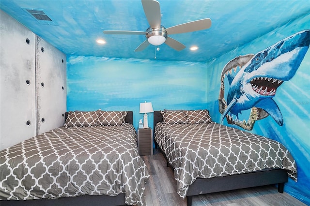 bedroom with wood-type flooring and ceiling fan