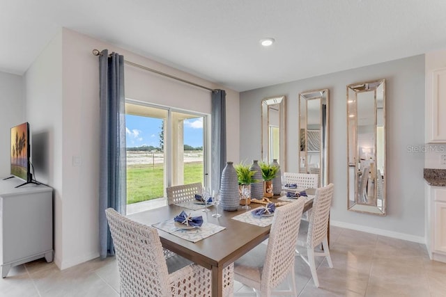 dining area with light tile patterned floors