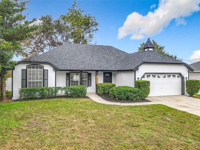 ranch-style house with a garage and a front yard