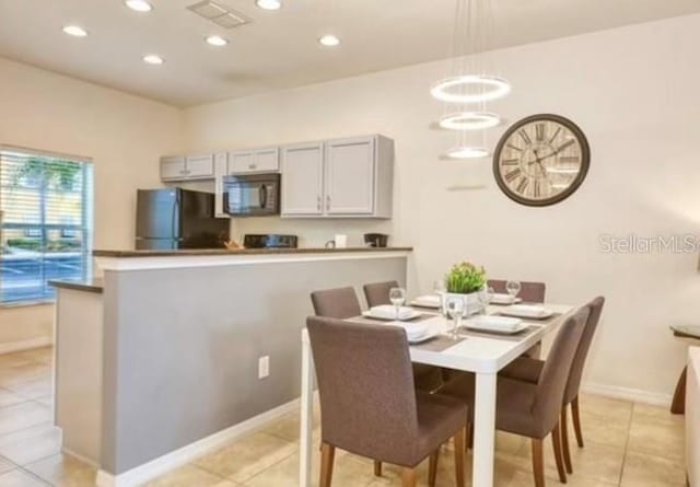 view of tiled dining space