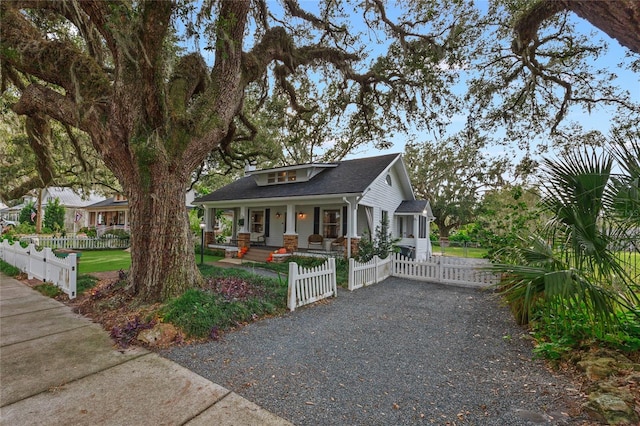 craftsman-style home featuring covered porch