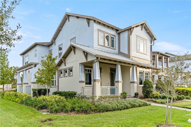 view of front of property featuring covered porch and a front lawn