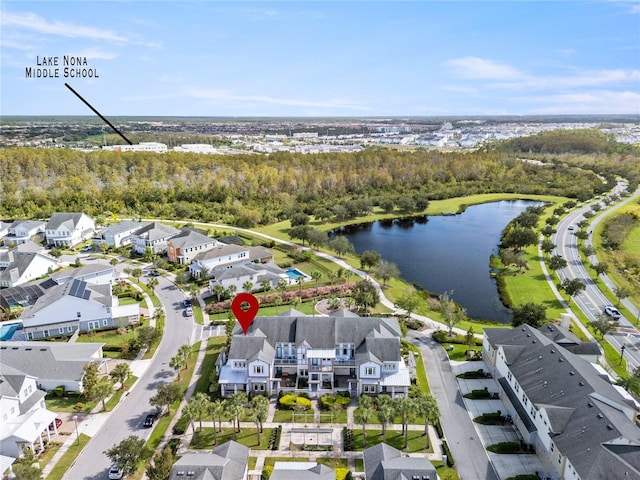 bird's eye view with a residential view, a water view, and a wooded view