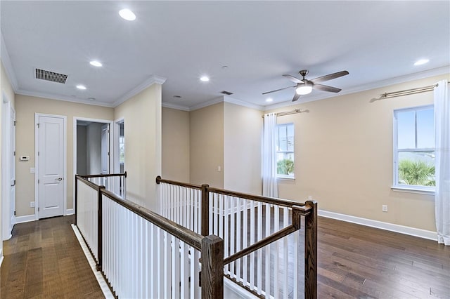 hallway featuring crown molding, an upstairs landing, and visible vents