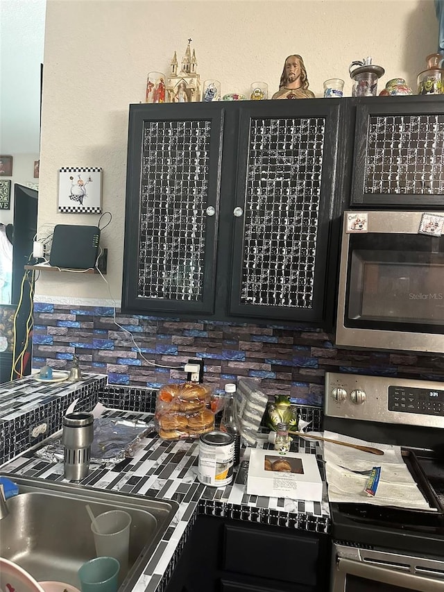 kitchen featuring decorative backsplash and appliances with stainless steel finishes