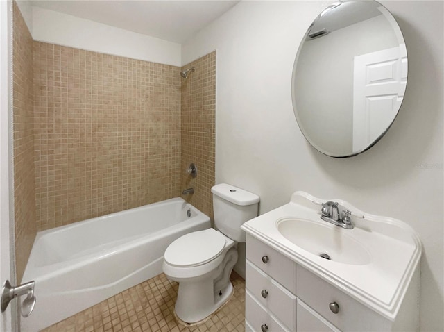 full bathroom featuring vanity, tiled shower / bath, and toilet