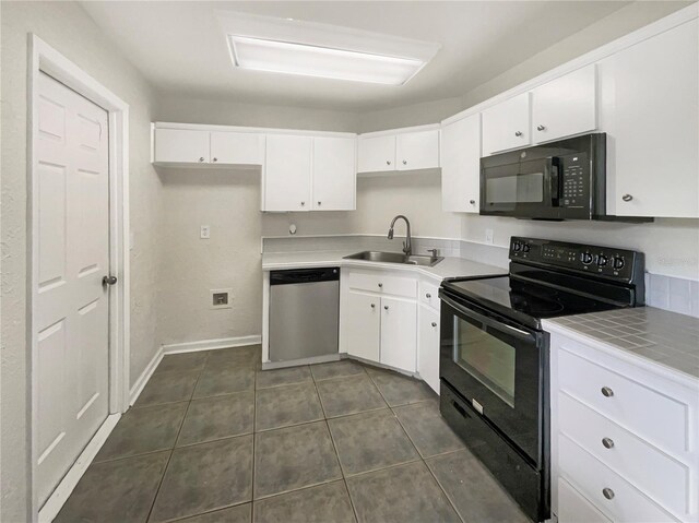 kitchen with white cabinets, black appliances, and sink