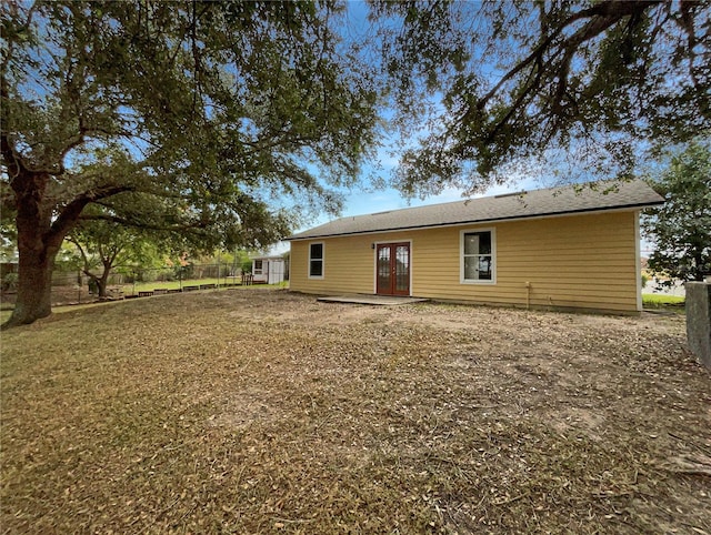 rear view of property featuring french doors