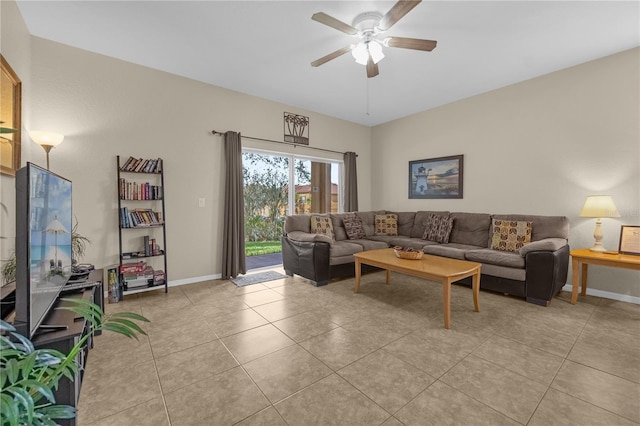 tiled living room featuring ceiling fan