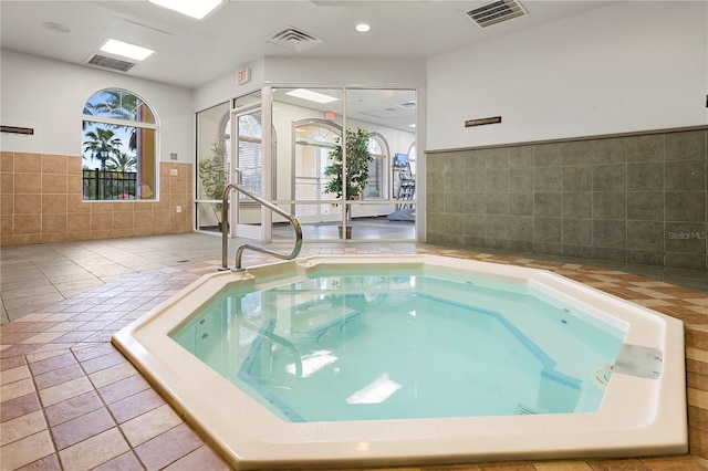 view of pool featuring an indoor hot tub