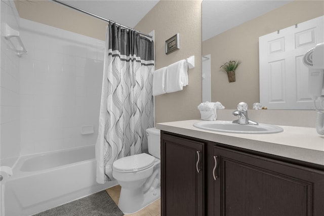 full bathroom with tile patterned flooring, shower / bath combination with curtain, toilet, and vanity