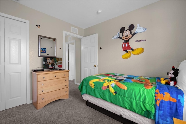 carpeted bedroom with a closet