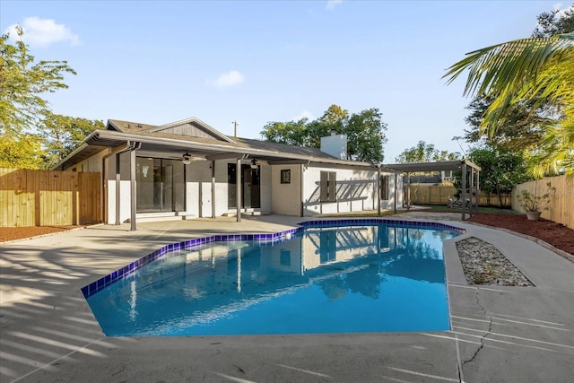 view of pool with a patio area and ceiling fan