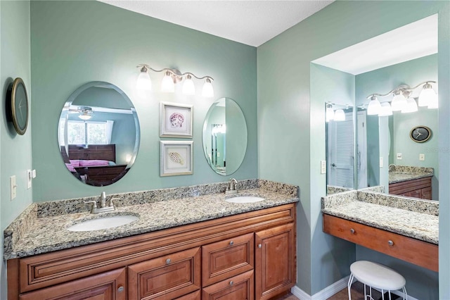 bathroom featuring vanity and ceiling fan