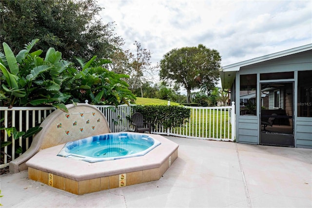 view of pool with a sunroom and a patio