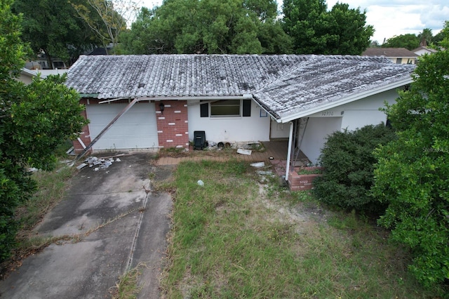 single story home with a garage