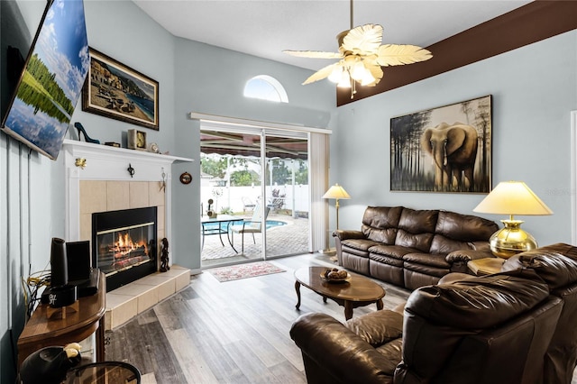 living room with hardwood / wood-style floors, a fireplace, and ceiling fan