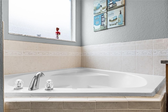 bathroom with tiled tub