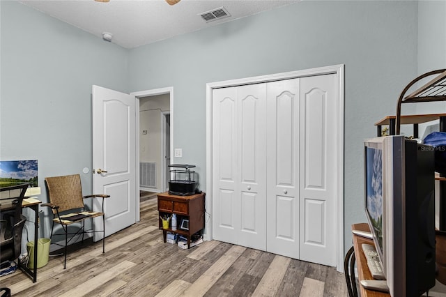 office area featuring a textured ceiling and light wood-type flooring