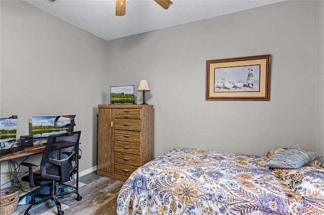 bedroom with hardwood / wood-style flooring and ceiling fan