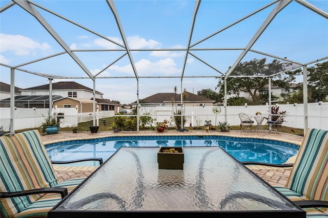 view of pool with a lanai and a patio