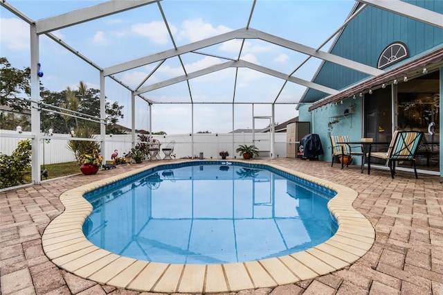 view of pool featuring a patio and a lanai