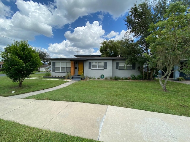 ranch-style home with a front yard