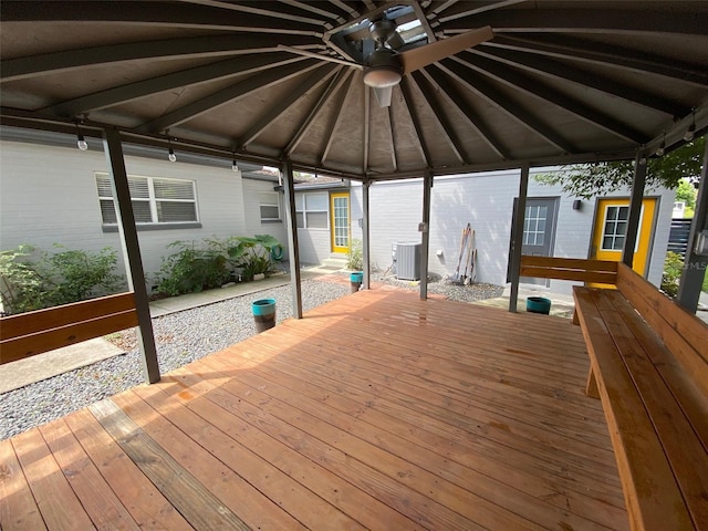 wooden deck featuring a gazebo, ceiling fan, and central air condition unit