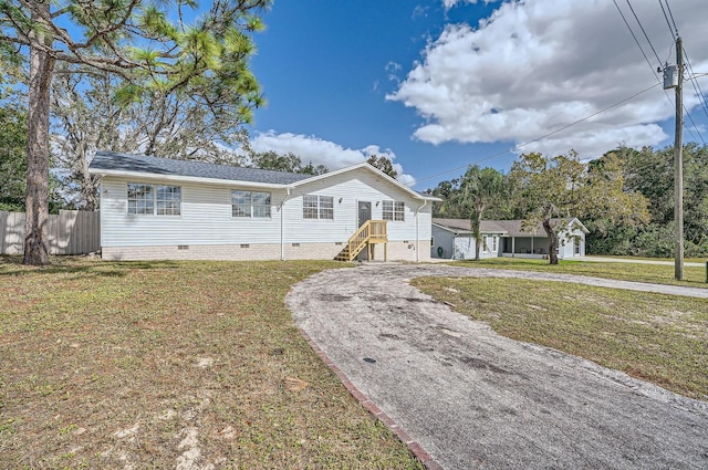 11335 Pickford St, Spring Hill, FL 34609 - view of front of home featuring crawl space and curved driveway
