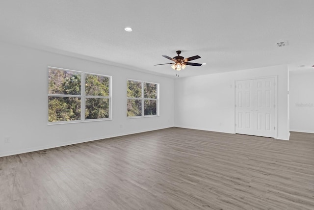 spare room featuring ceiling fan and wood-type flooring