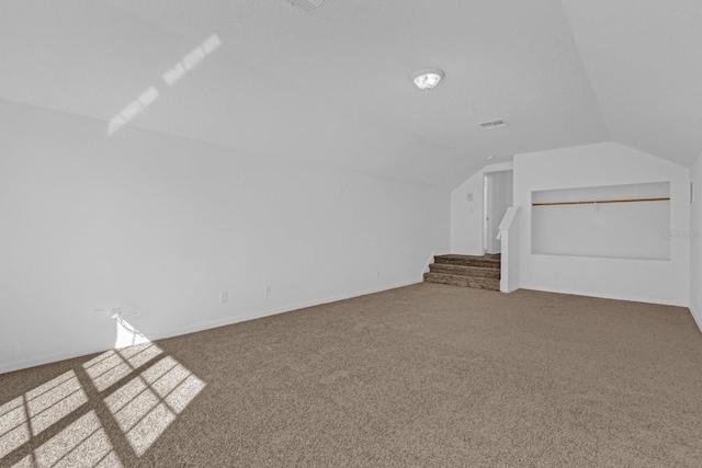 bonus room featuring carpet flooring and lofted ceiling