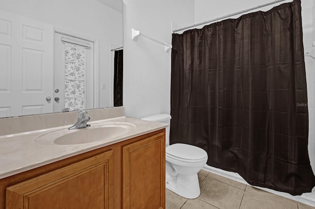 full bathroom with tile patterned flooring, vanity, shower / bath combination with curtain, and toilet