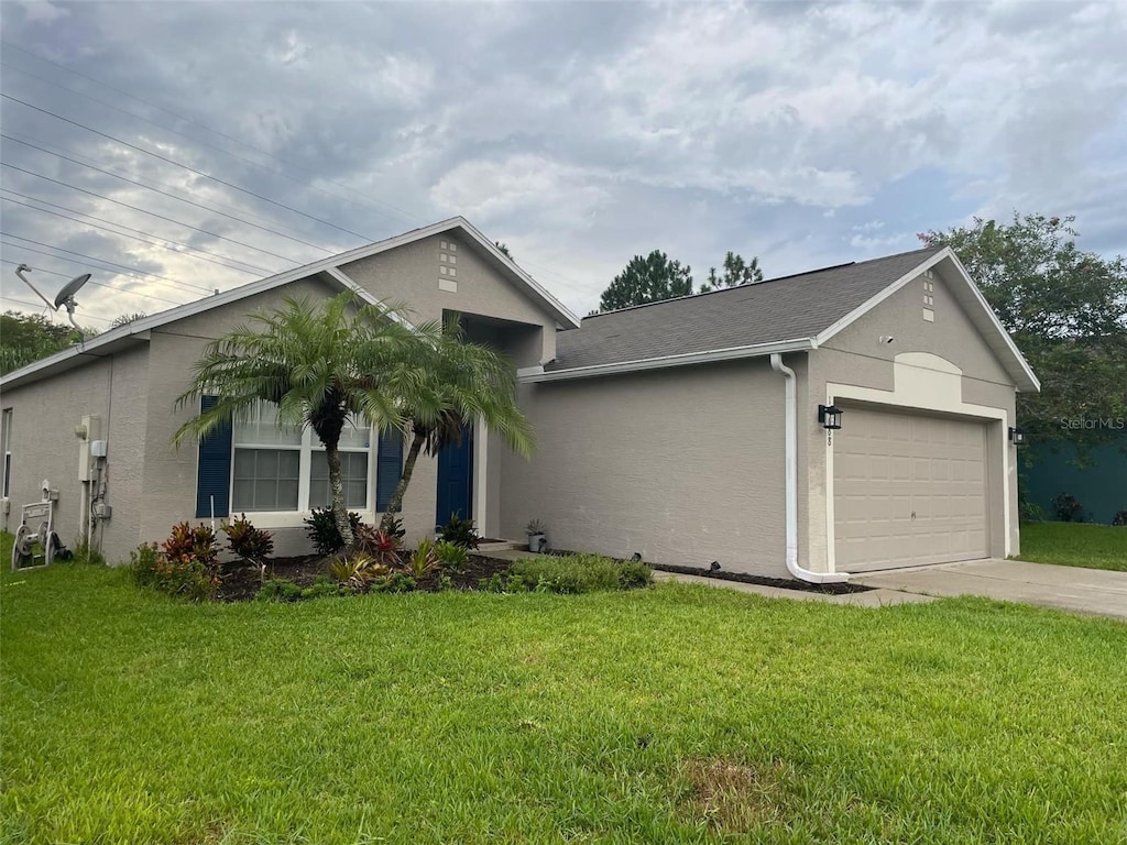 single story home with a garage and a front yard