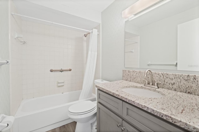 full bathroom with hardwood / wood-style flooring, vanity, toilet, and shower / tub combo with curtain