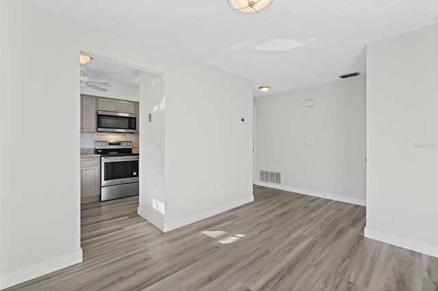 interior space featuring ceiling fan and light hardwood / wood-style floors